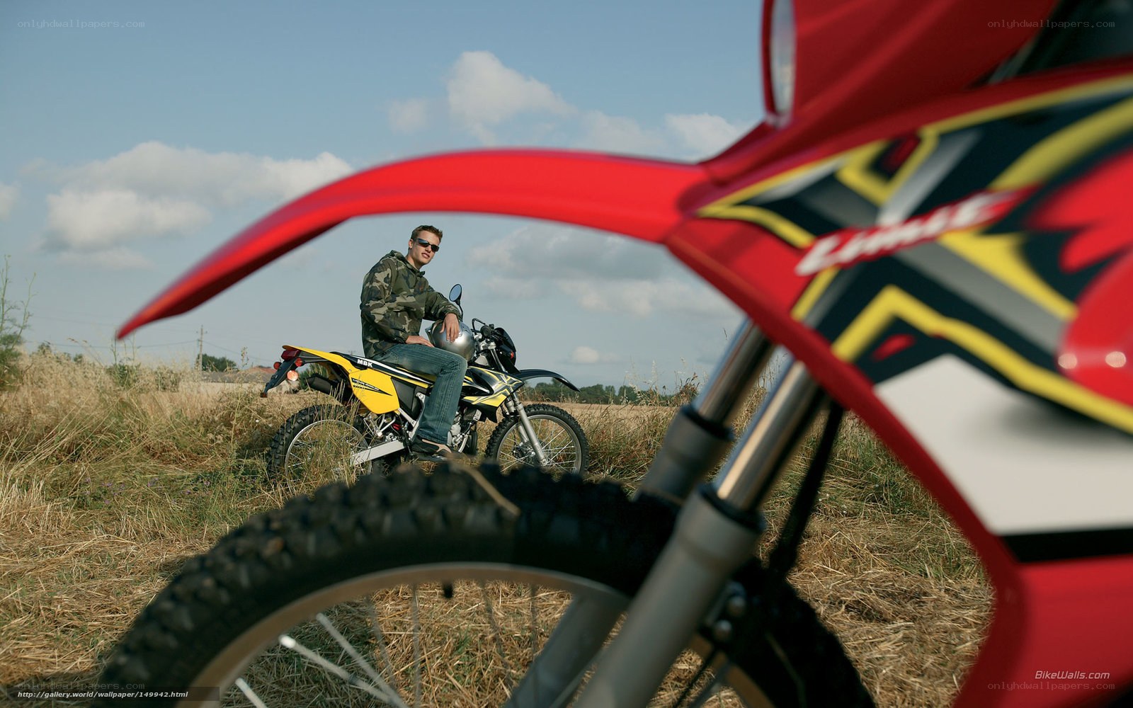 Man on dirt bike in field