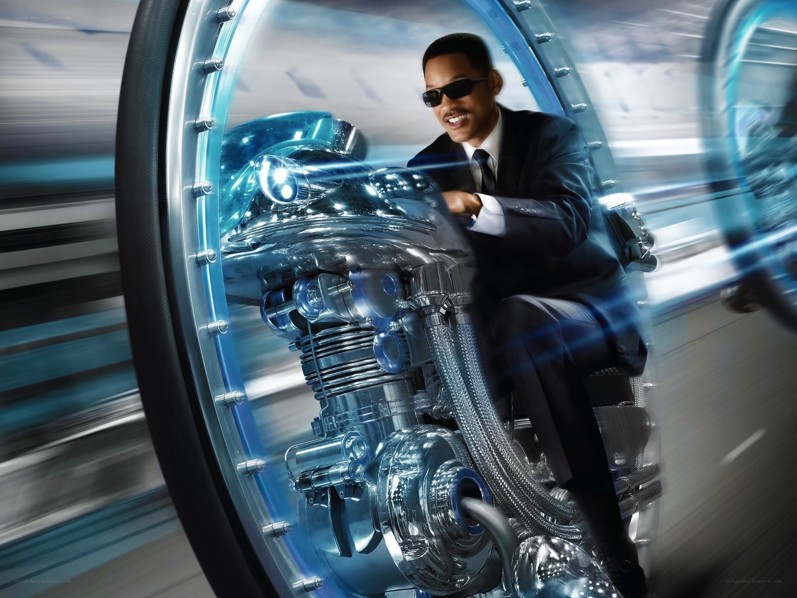 man on futuristic motorcycle