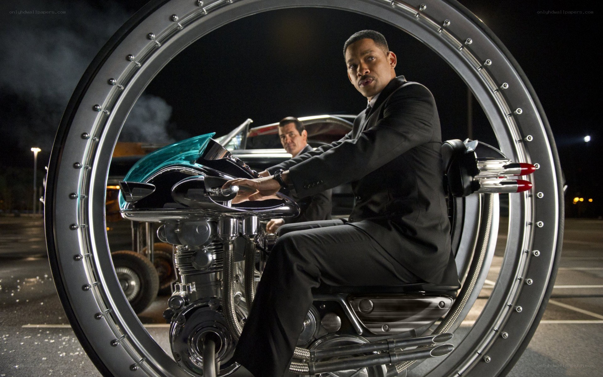 man on futuristic motorcycle