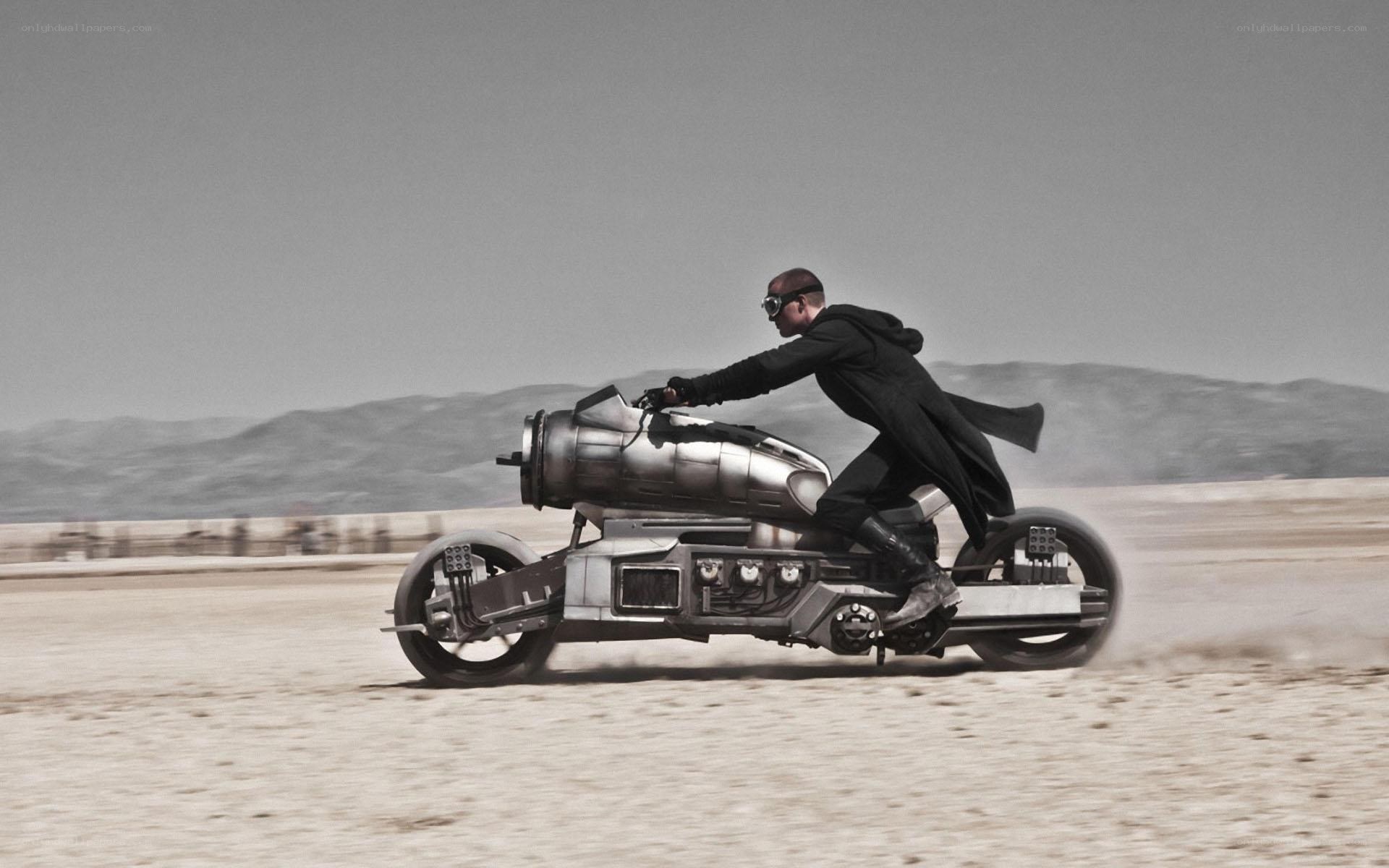 Man on futuristic motorcycle