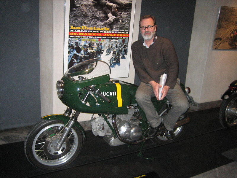 Man on Green Motorcycle
