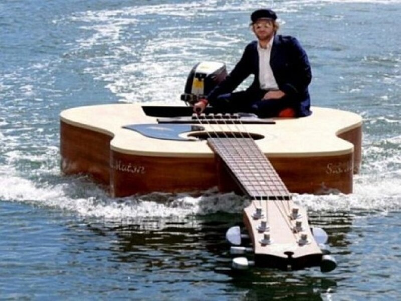 Man on Guitar Boat