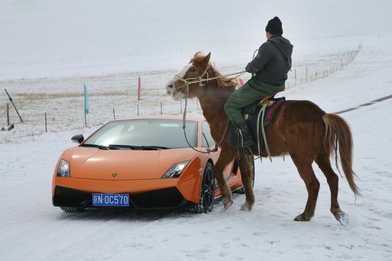 Man on horse with orange car