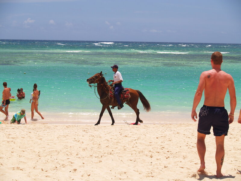 Man on horseback at beach