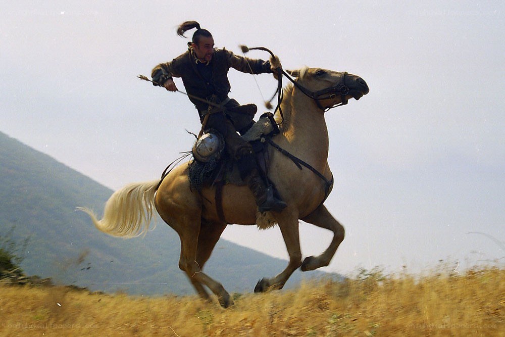 Man on horseback with bow