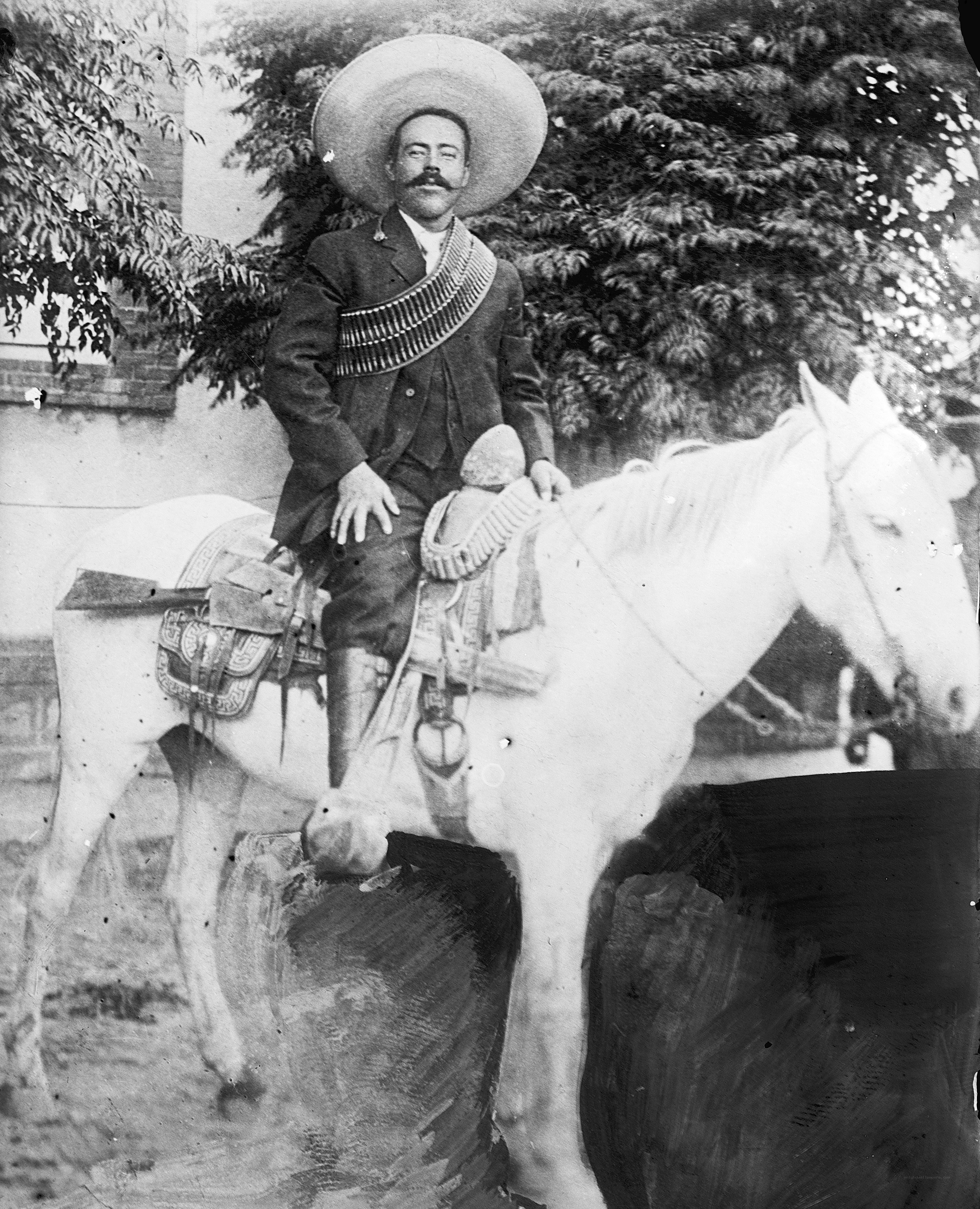 Man on horseback with sombrero