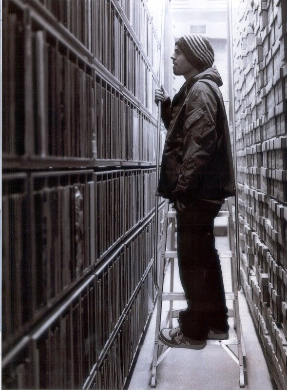 man on ladder in archive