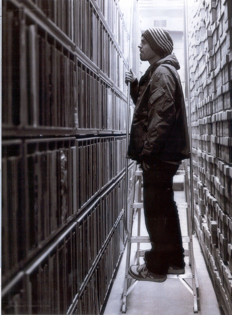 man on ladder in archive