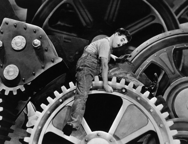 Man on Large Gear — Black, Dramatic