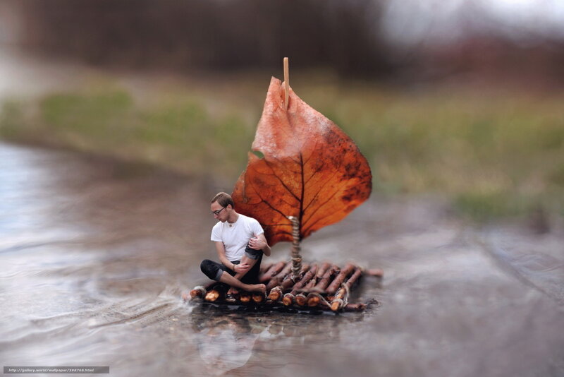 Man on leaf-sail raft