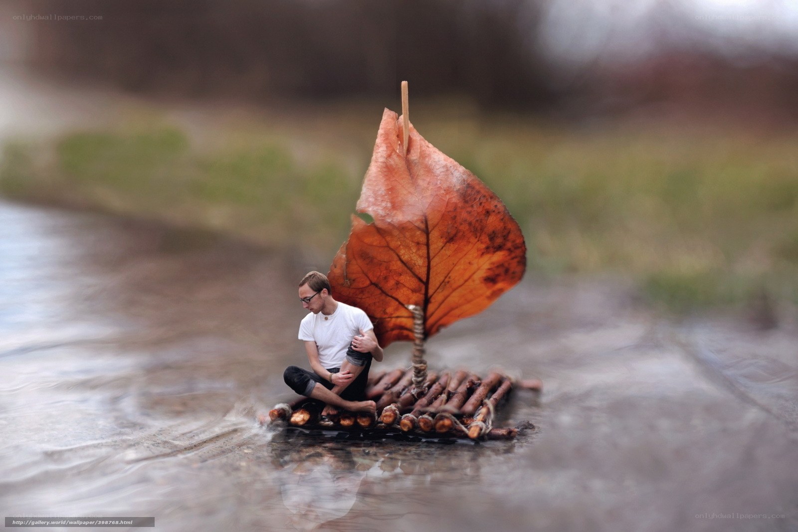 Man on leaf-sail raft