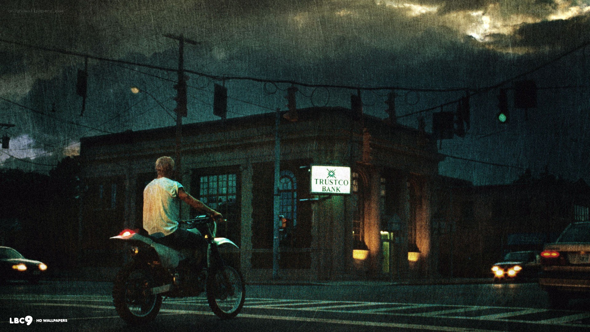 Man on motorcycle at night