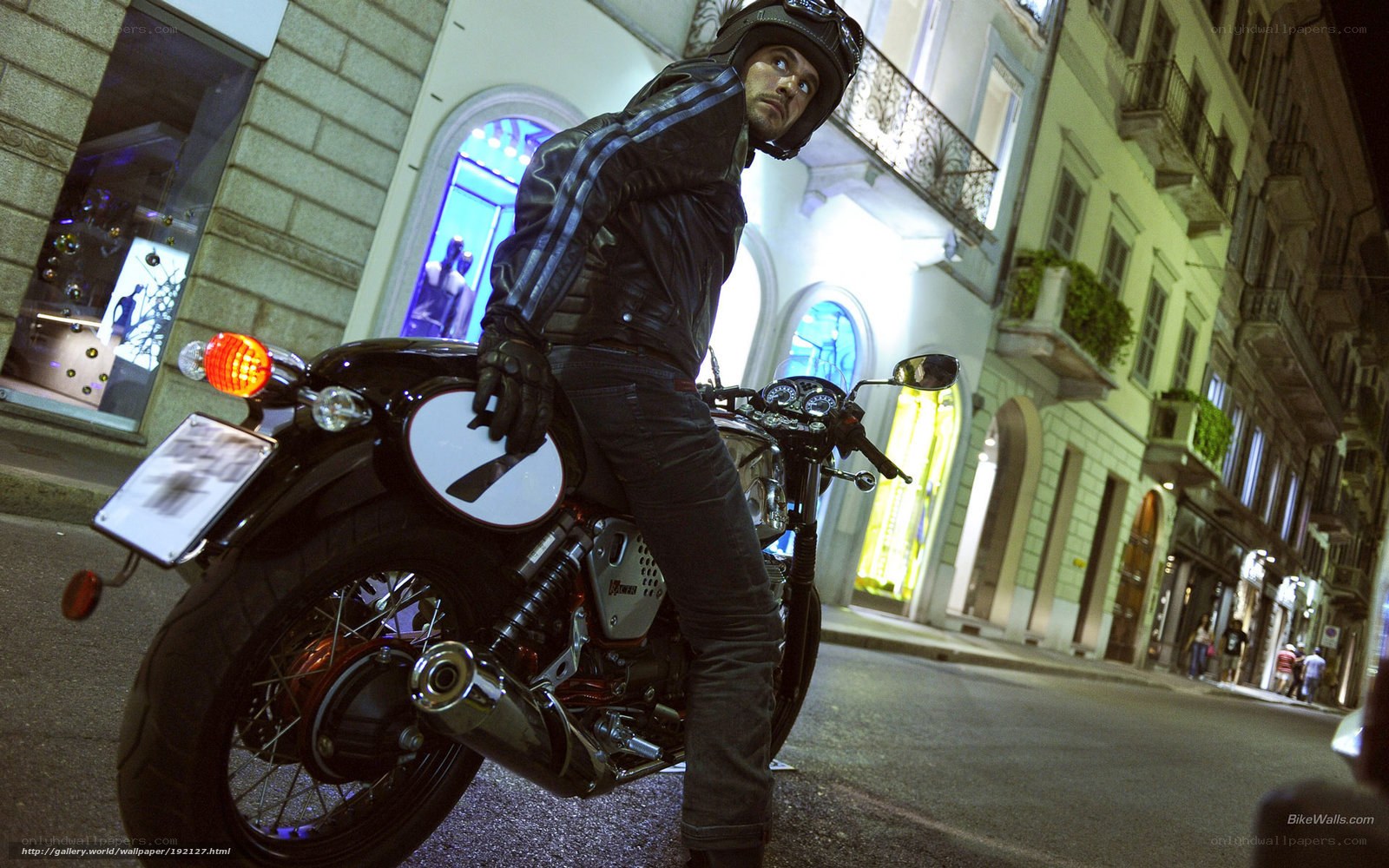 Man on motorcycle at night