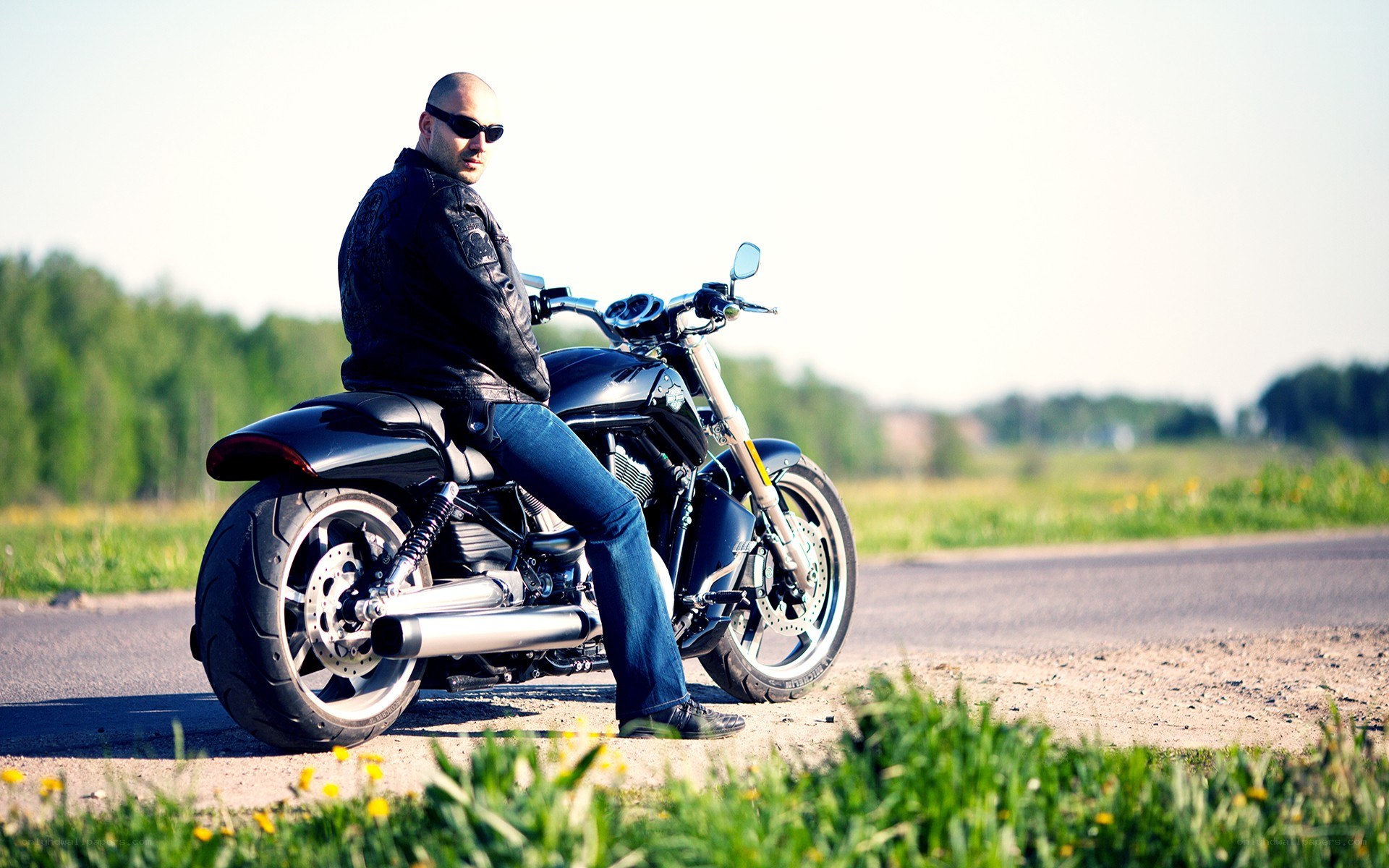 man on motorcycle by road