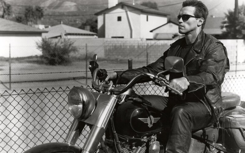 man on motorcycle in black and white