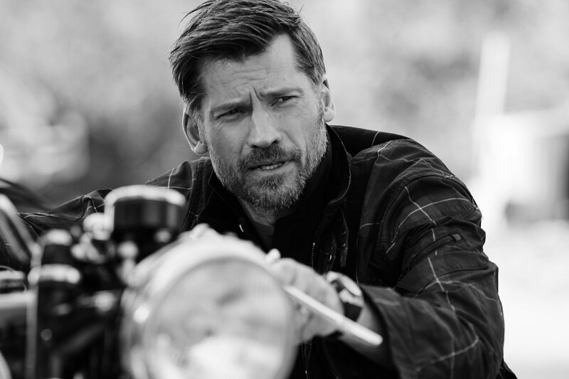 man on motorcycle in black and white