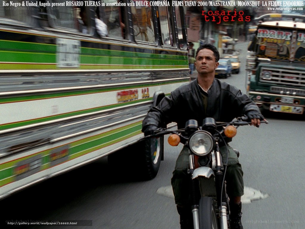 Man on motorcycle in traffic