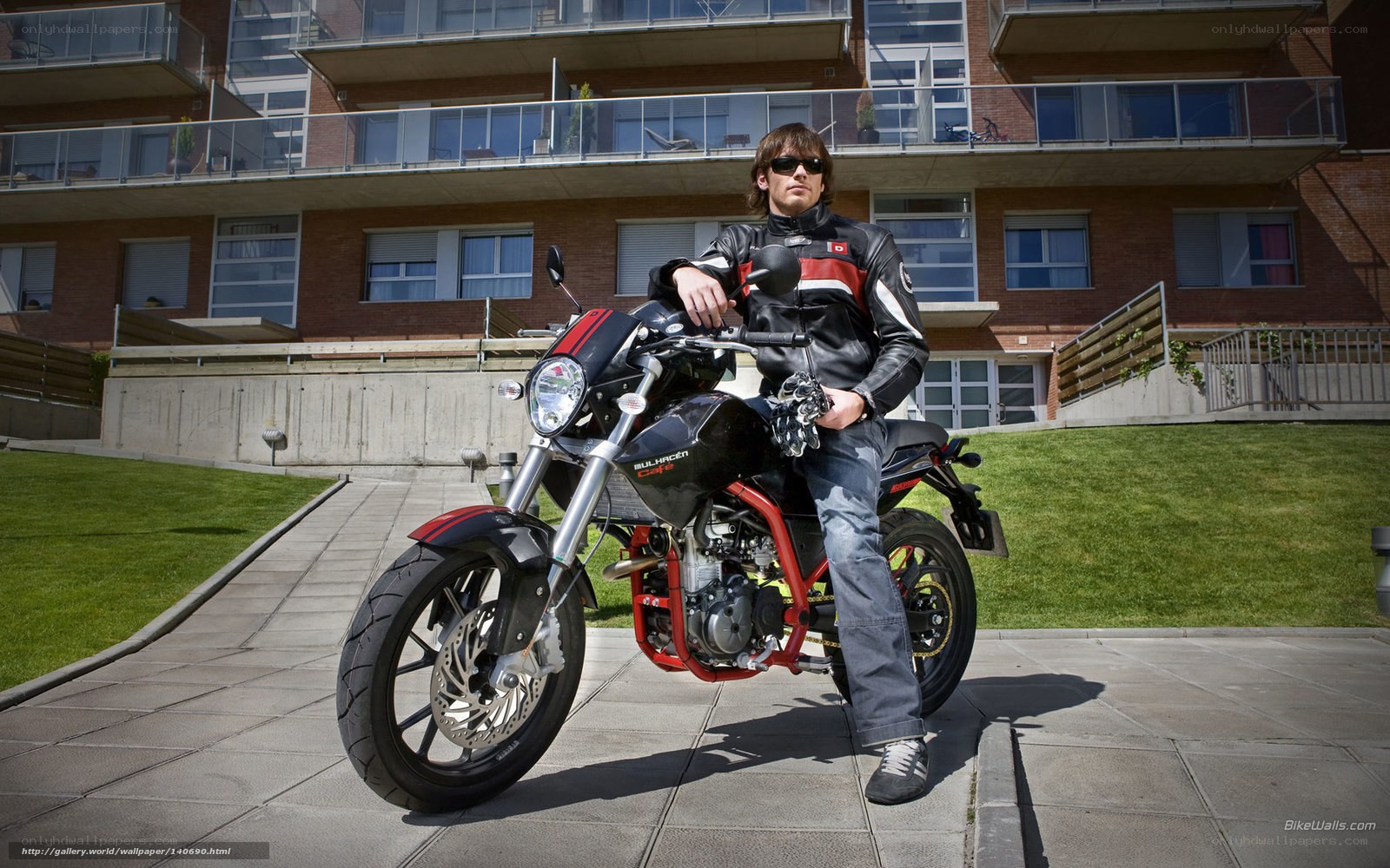 Man on motorcycle in urban setting