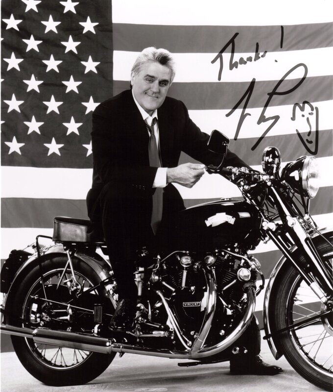 Man on motorcycle with flag