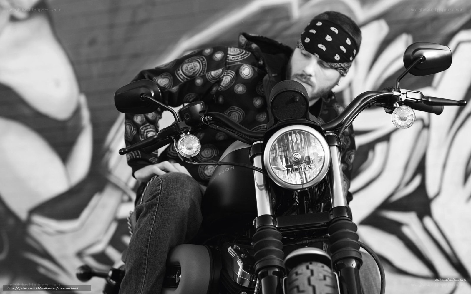 man on motorcycle with graffiti