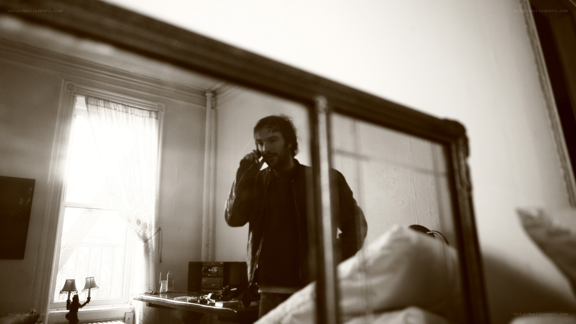 man on phone in bedroom