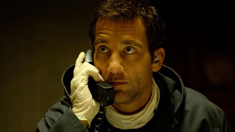 man on phone in dark room