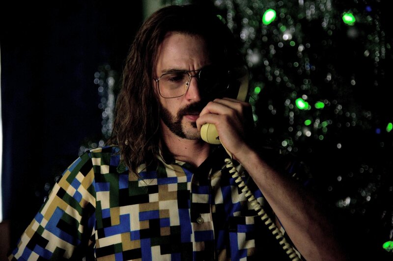 man on phone in dark room