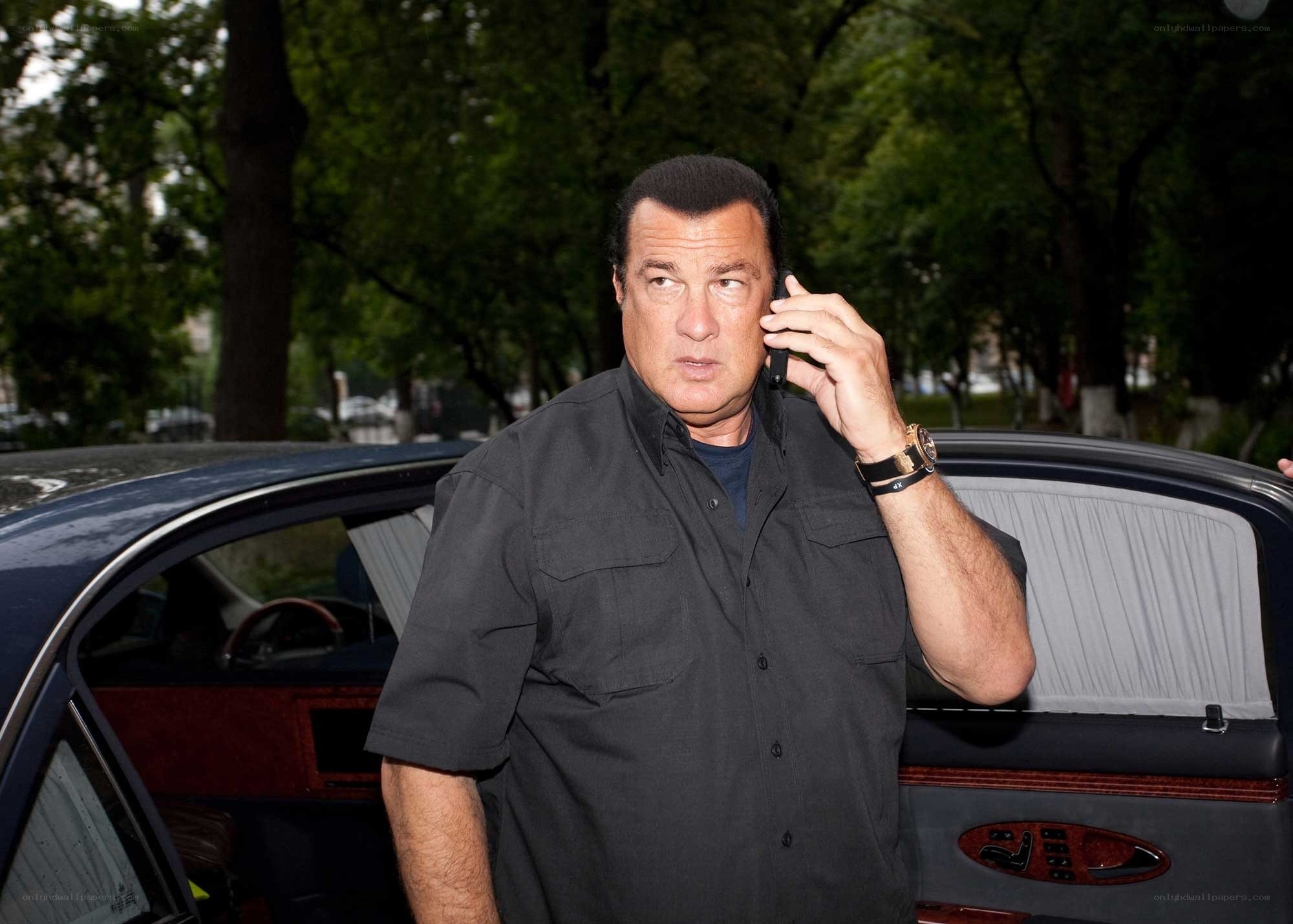 man on phone near car