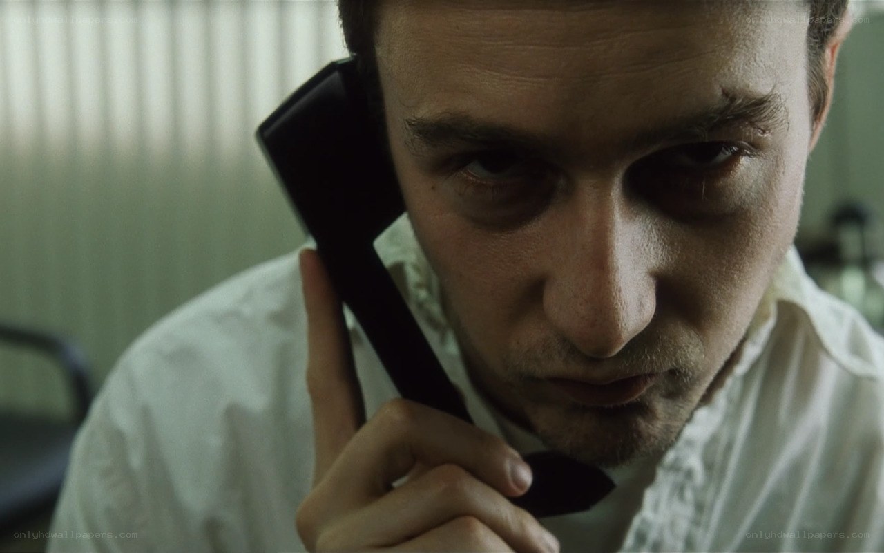man on phone with bruised eye
