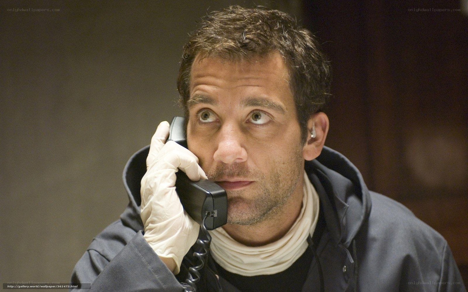 man on phone with glove
