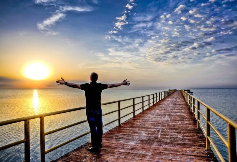 Man on Pier at Sunset — Blue