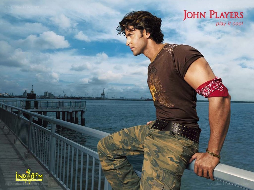 man on pier by water