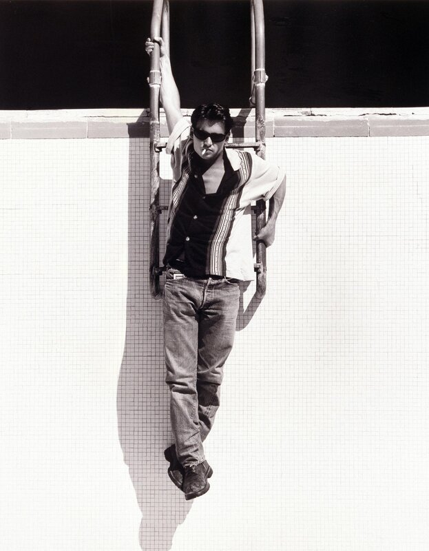 Man on pool ladder