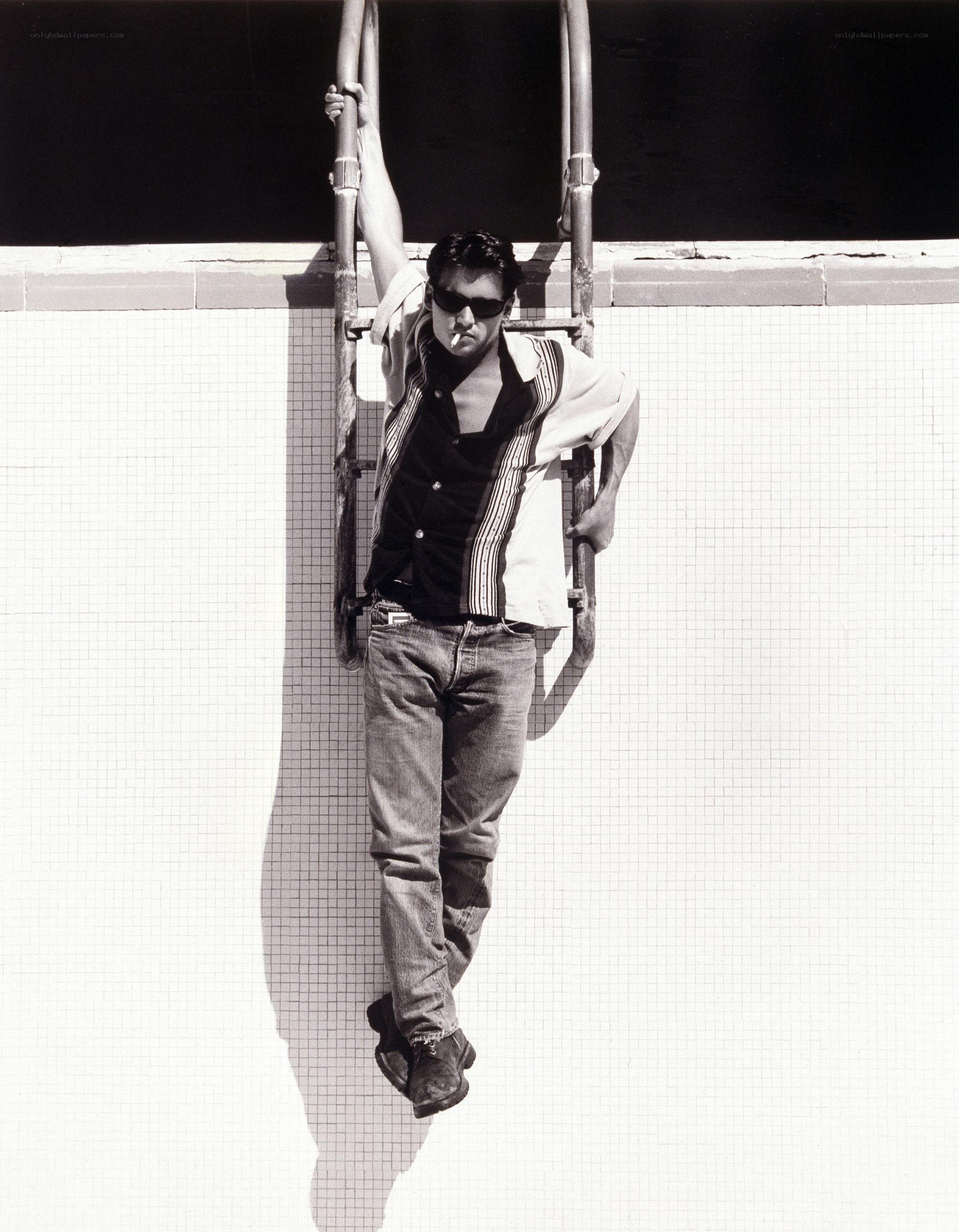 Man on pool ladder