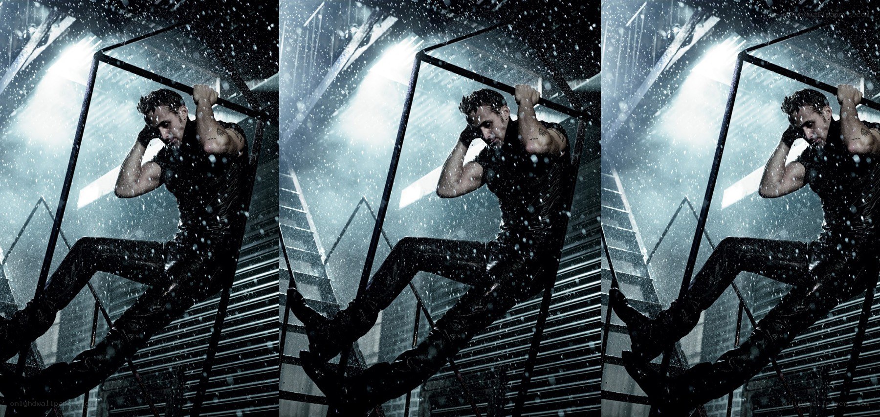 man on pull-up bar in rain