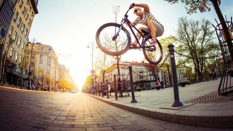 Man on Purple Bike