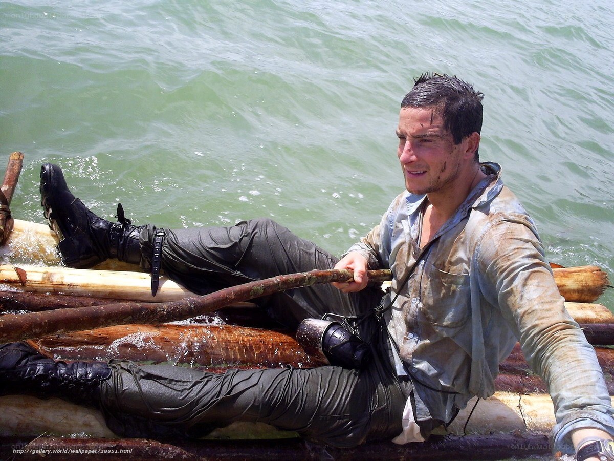 man on raft in water