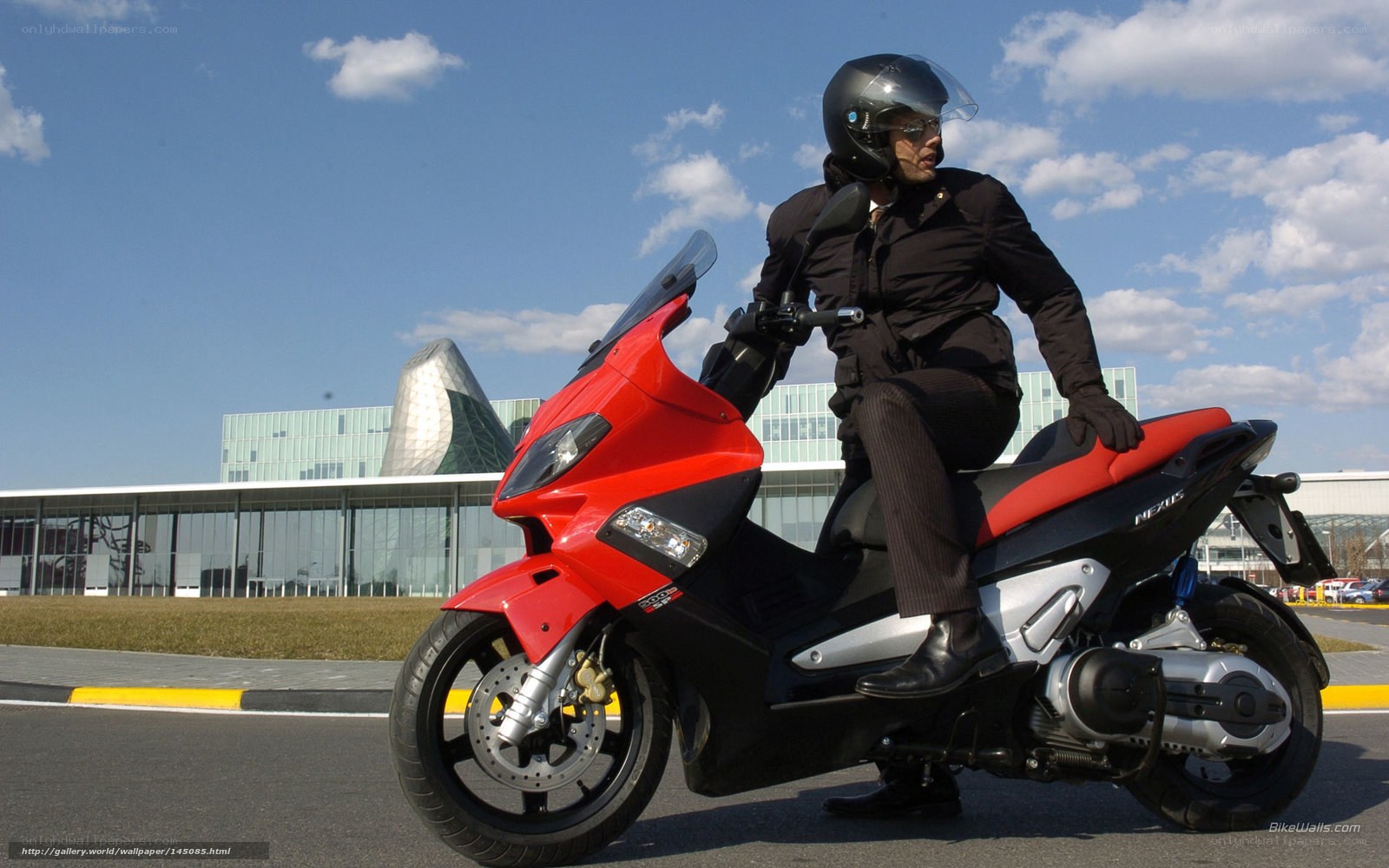 Man on red scooter