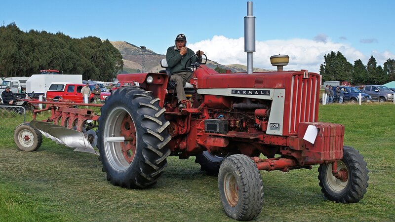 Man on Red Tractor — Outdoor