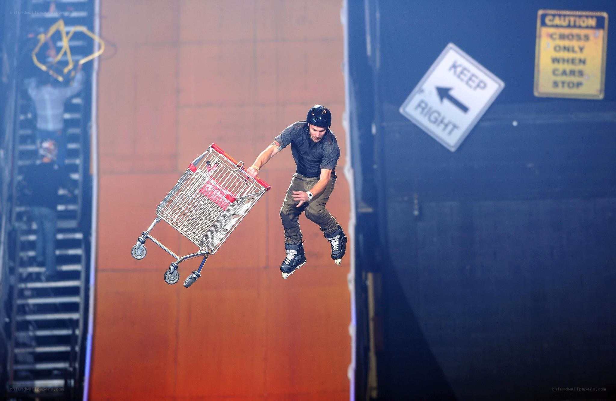 Man on roller skates with shopping cart