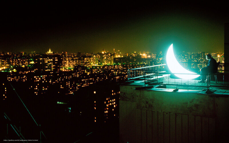 Man on rooftop at night