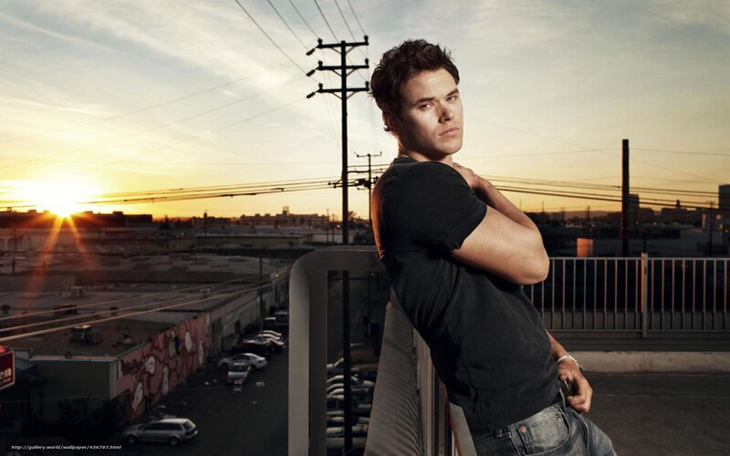 Man on Rooftop at Sunset — Orange