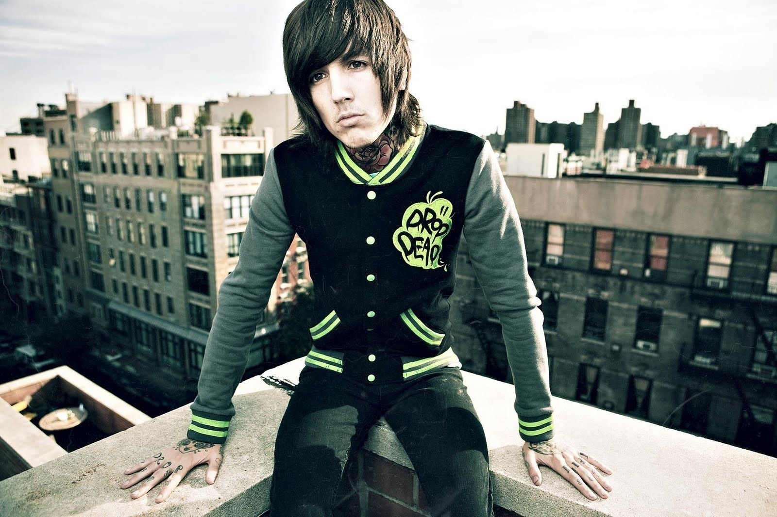 man on rooftop in city