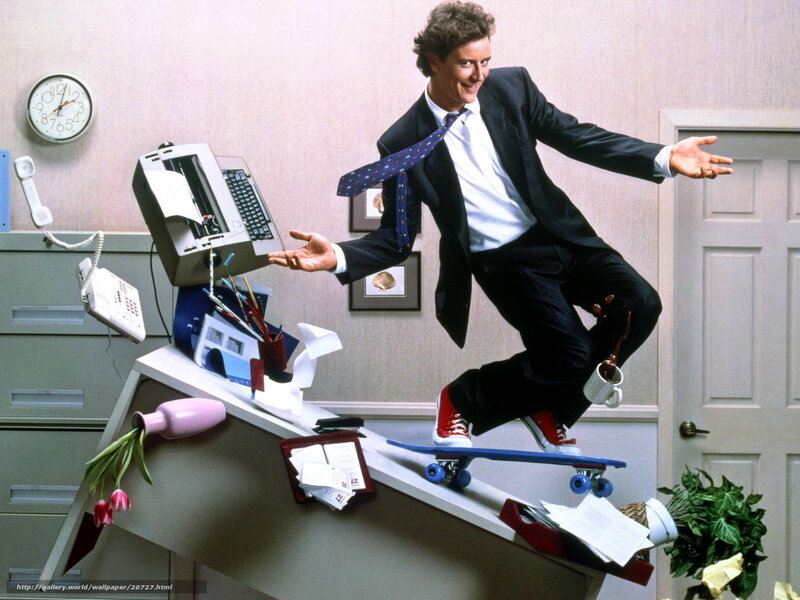 Man on skateboard in office