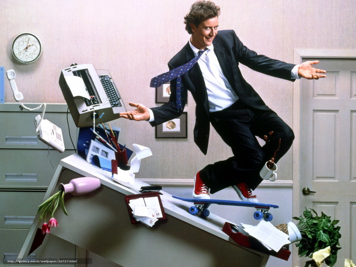 Man on skateboard in office