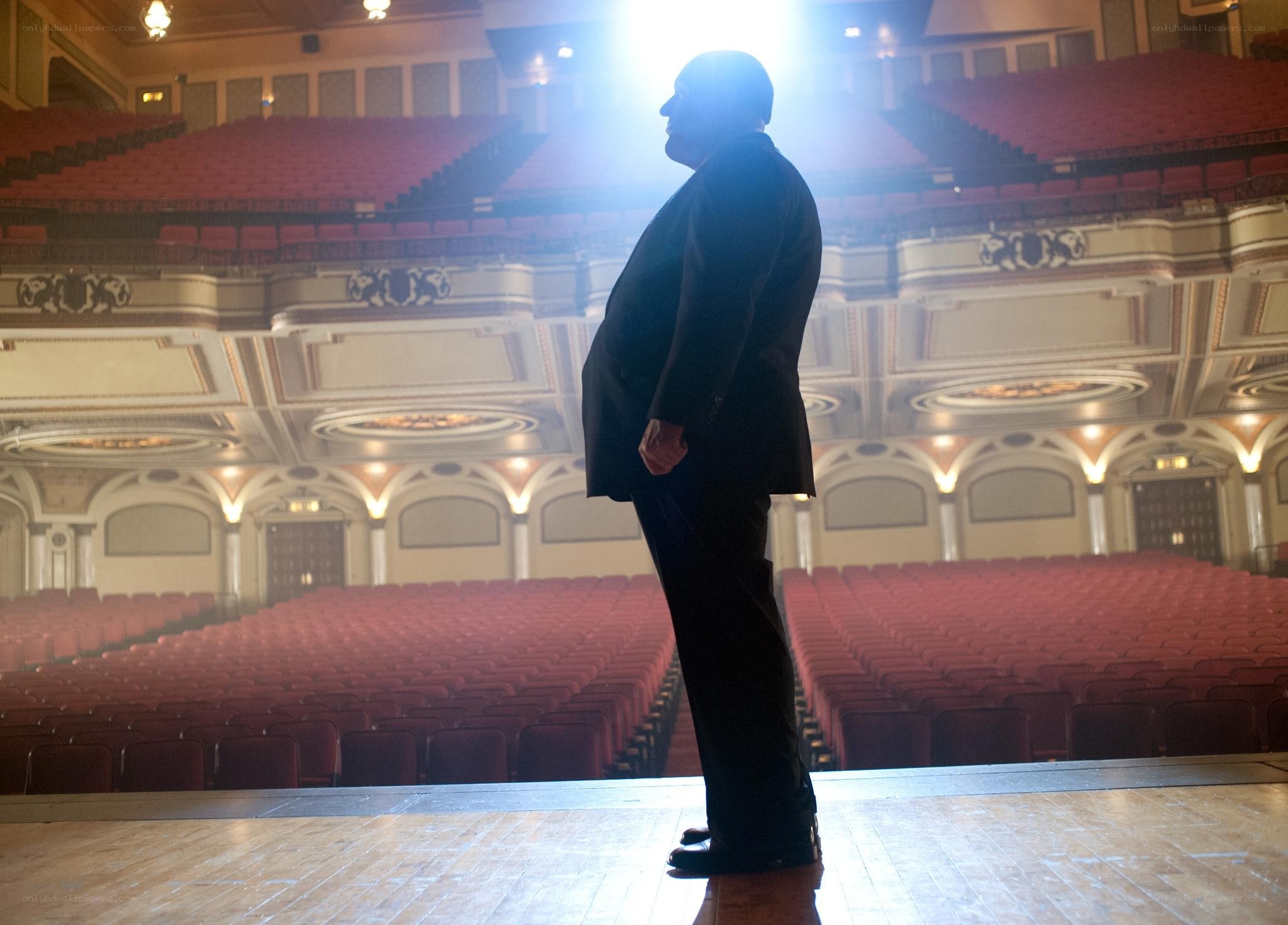 Man on stage in theater