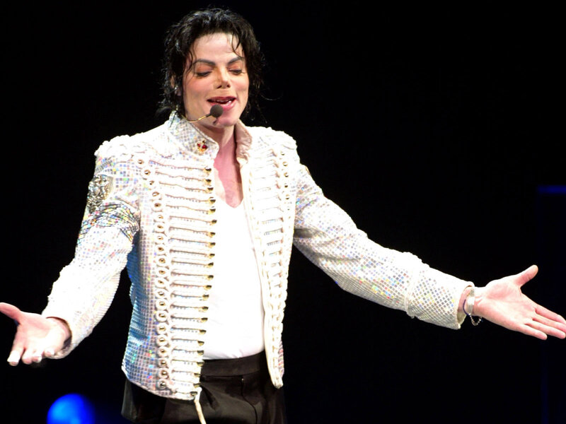 Man on Stage Performing — White