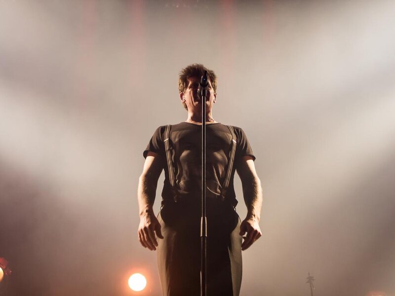 Man on Stage Singing — Black