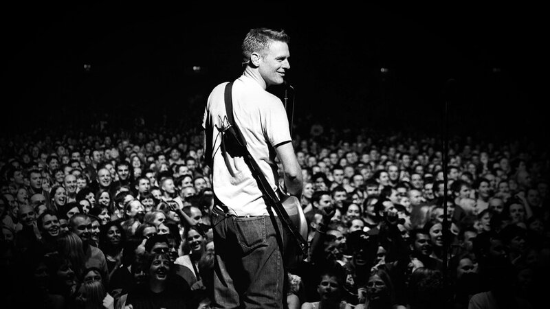 Man on Stage with Guitar — Black, Energetic