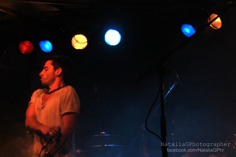 Man on Stage with Guitar